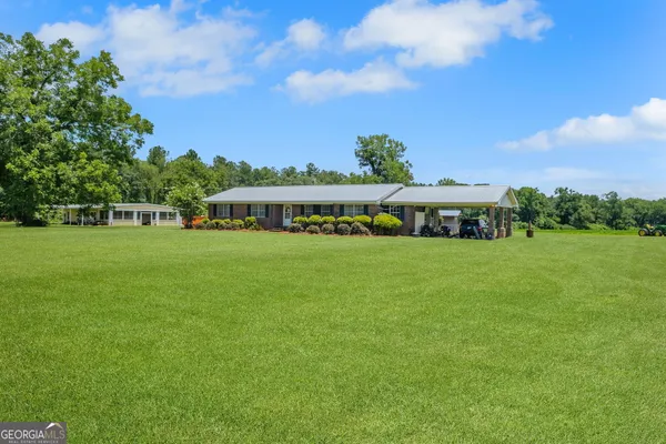 a view of house with outdoor space