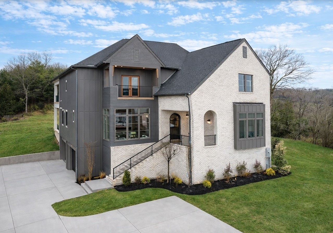 a front view of a house with a yard