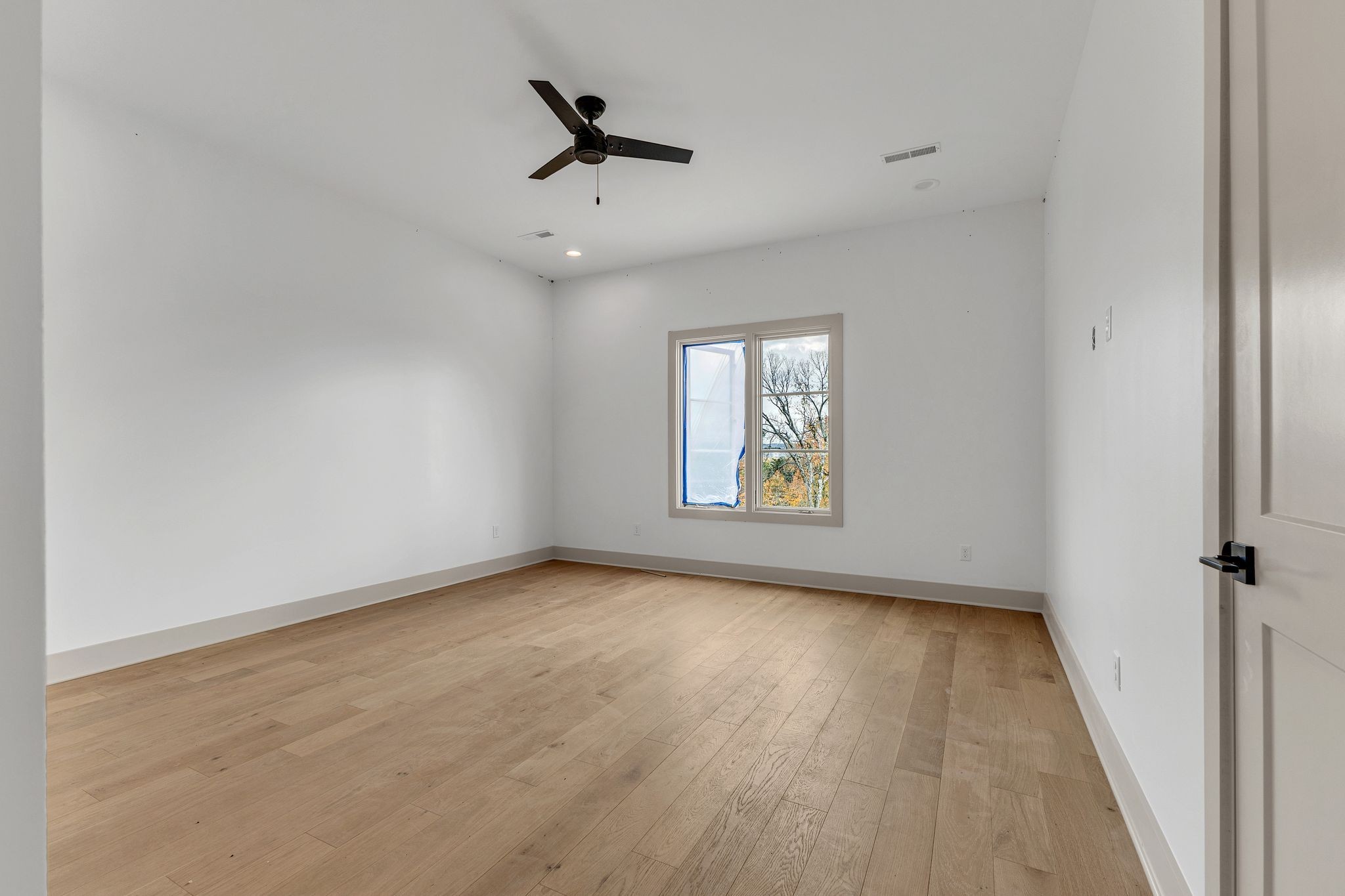 459 Franklin Road Franklin, TN 37069 - Photo 27 of 40 wooden floor in an empty room with a window