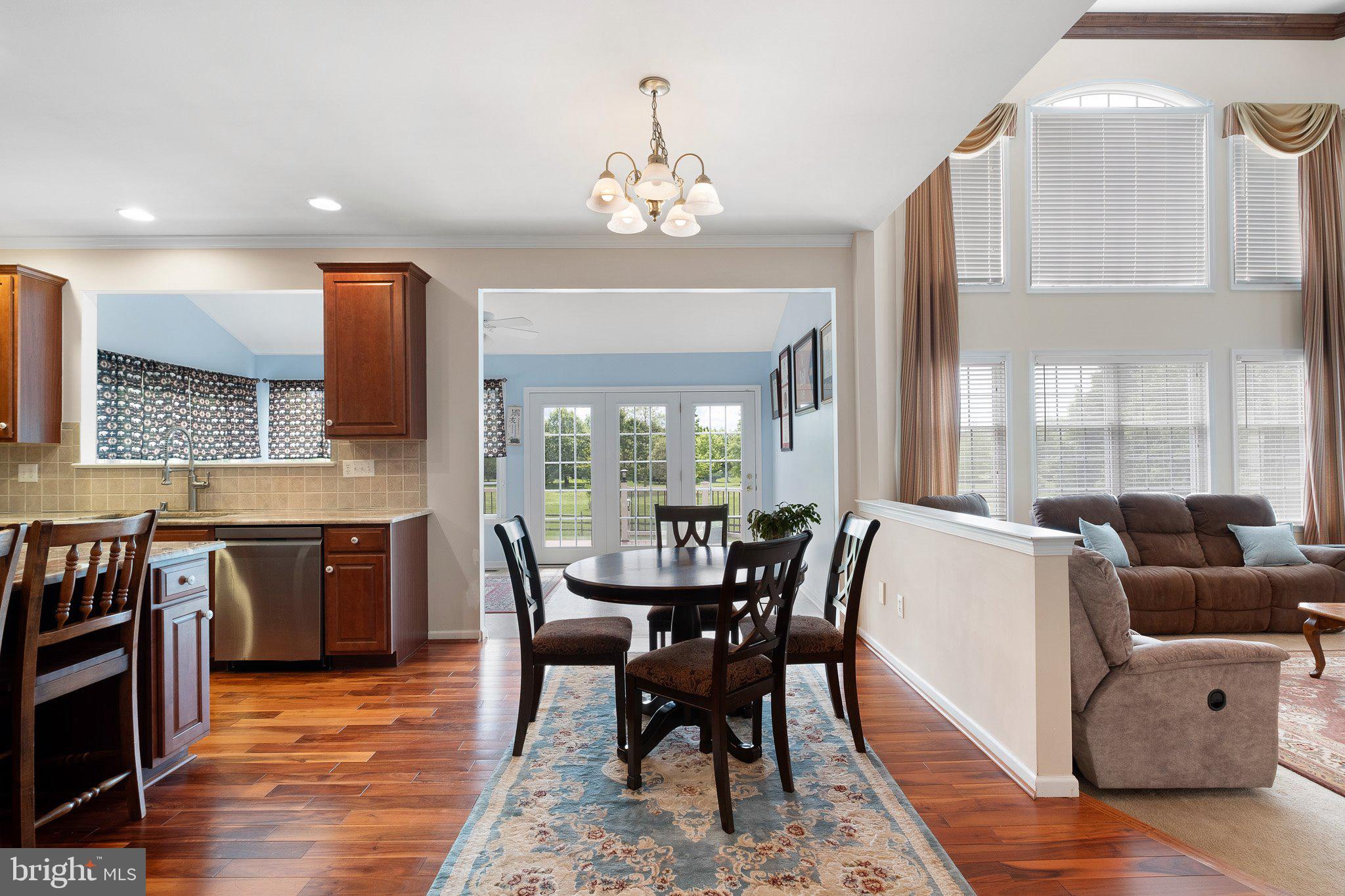 407 Nattull Drive Bear, DE 19701 - Photo 14 of 65 a view of a dining room with furniture window and wooden floor