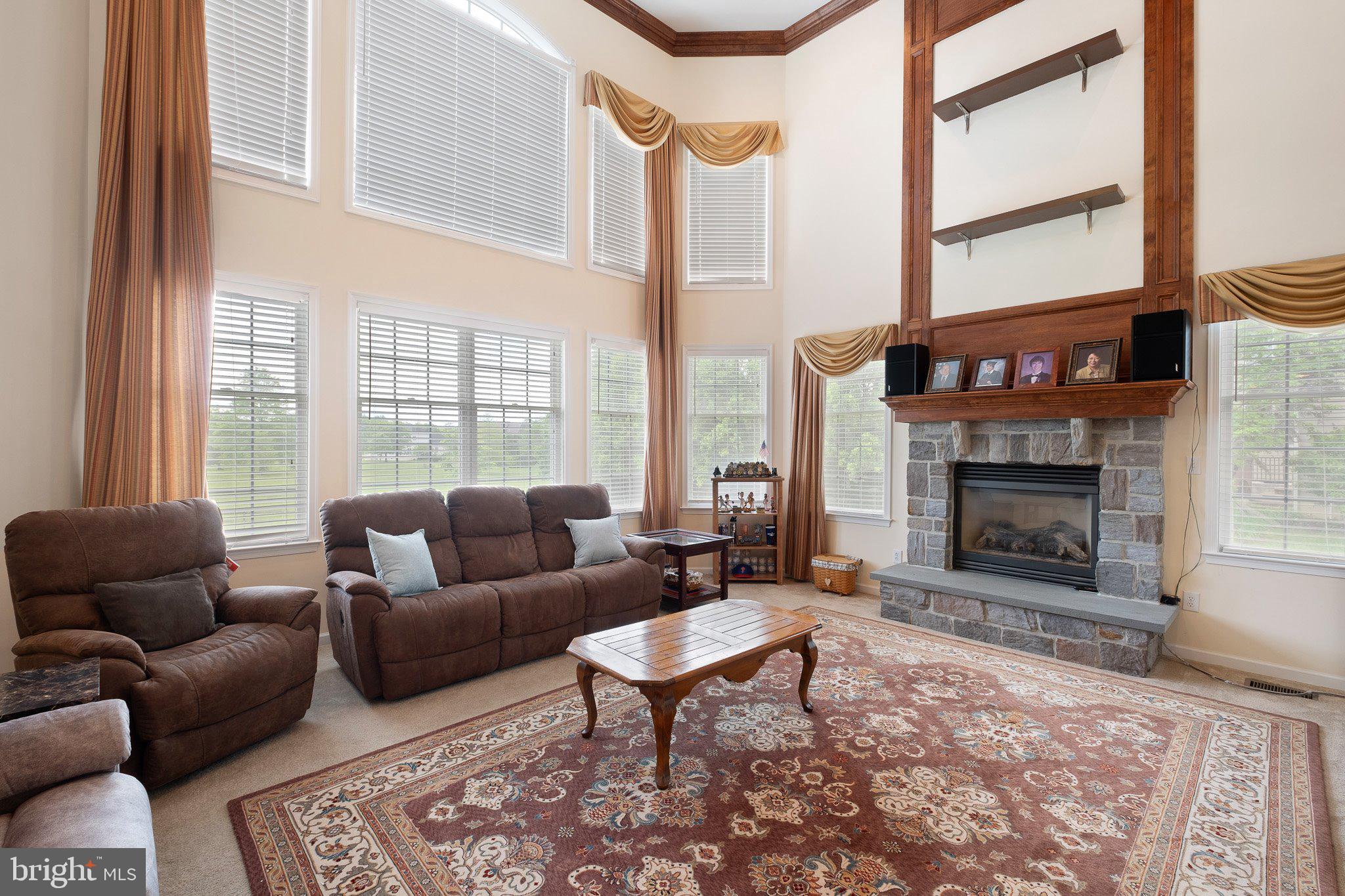407 Nattull Drive Bear, DE 19701 - Photo 16 of 65 a living room with furniture and a fireplace