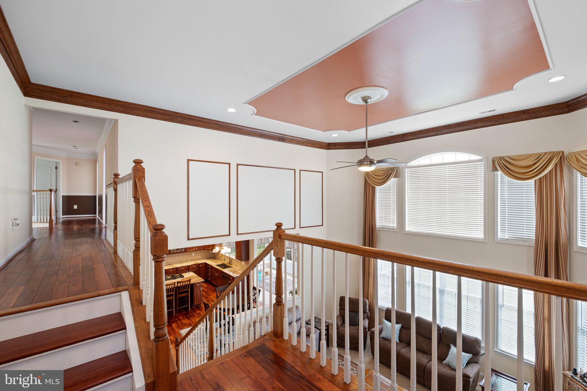 407 Nattull Drive Bear, DE 19701 - Photo 19 of 65 a view of a hallway with wooden floor and stairs