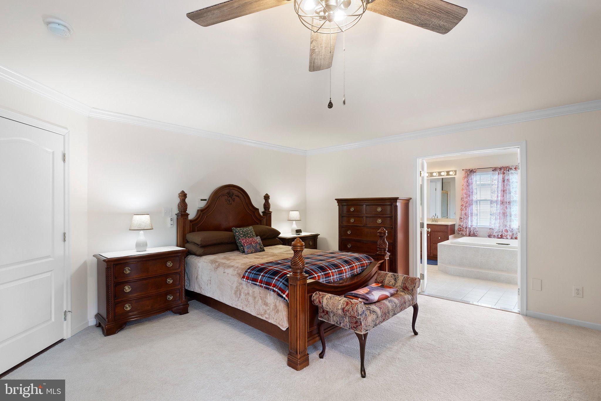 407 Nattull Drive Bear, DE 19701 - Photo 24 of 65 a bedroom with a bed and a couch