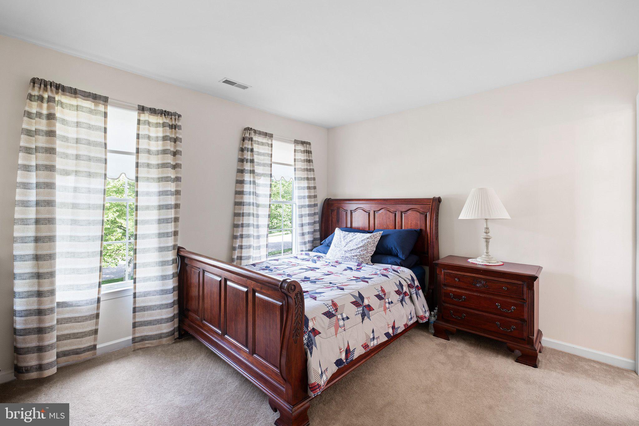 407 Nattull Drive Bear, DE 19701 - Photo 37 of 65 a bedroom with a bed and a window