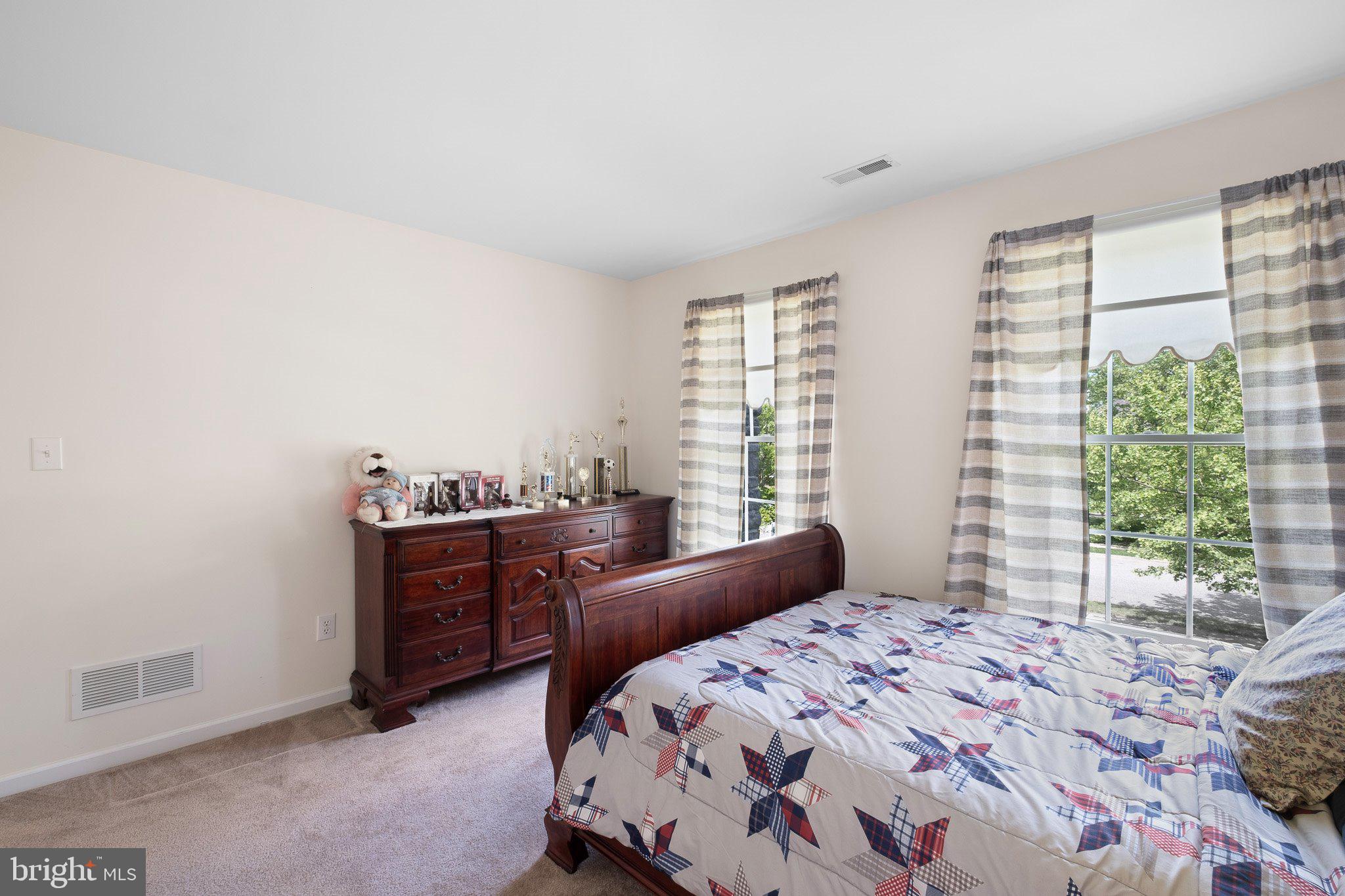 407 Nattull Drive Bear, DE 19701 - Photo 38 of 65 a bedroom with a bed and a window