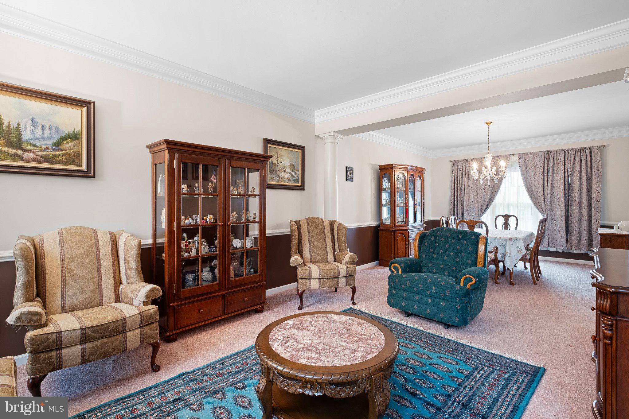 407 Nattull Drive Bear, DE 19701 - Photo 4 of 65 a living room with furniture a rug and a large window