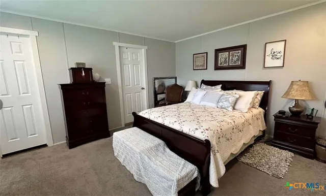a bedroom with a bed and walk in closet