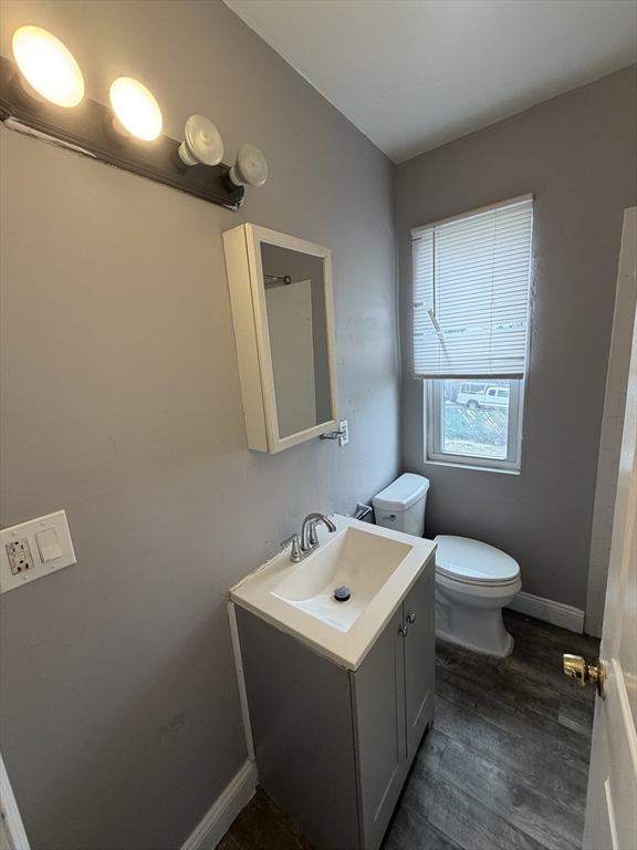 43 Adams Street, Unit 1 Lynn, MA 01902 - Photo 9 of 10 a bathroom with a sink mirror and toilet