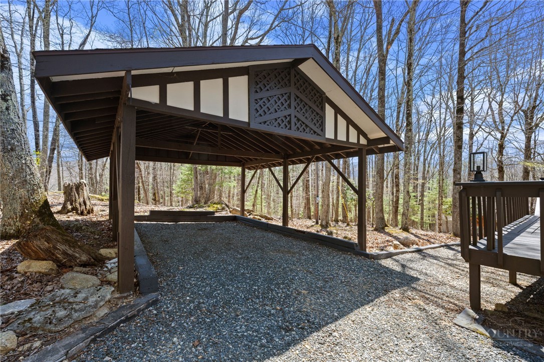 811 Pine Ridge Road Beech Mountain, NC 28604 - Photo 3 of 26 a view of a house with a yard