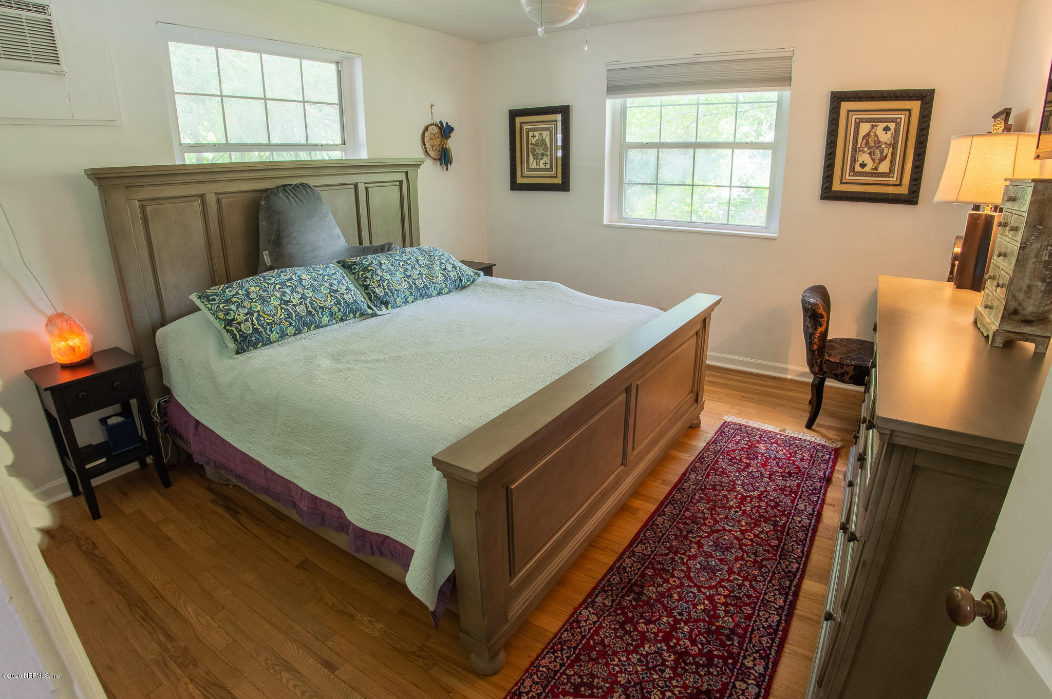 5418 Stetson Road Jacksonville, FL 32207 - Photo 18 of 34 a bed sitting in a bedroom next to a window