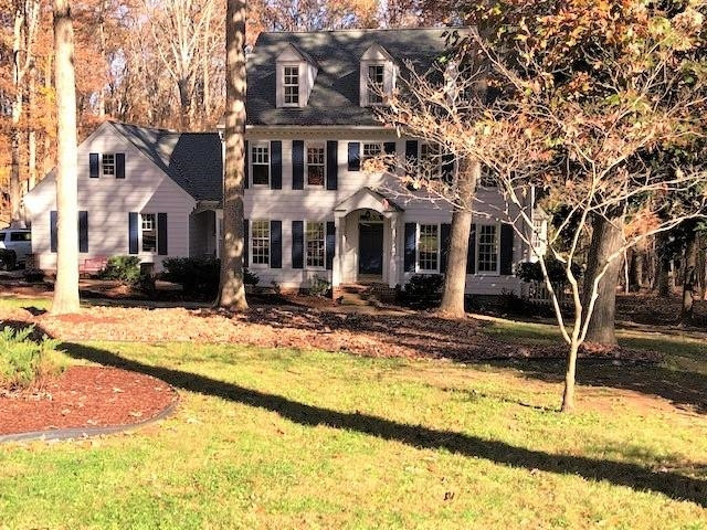 912 Brookfield Road Raleigh, NC 27615 - Photo 4 of 5 a view of a house with snow on the road