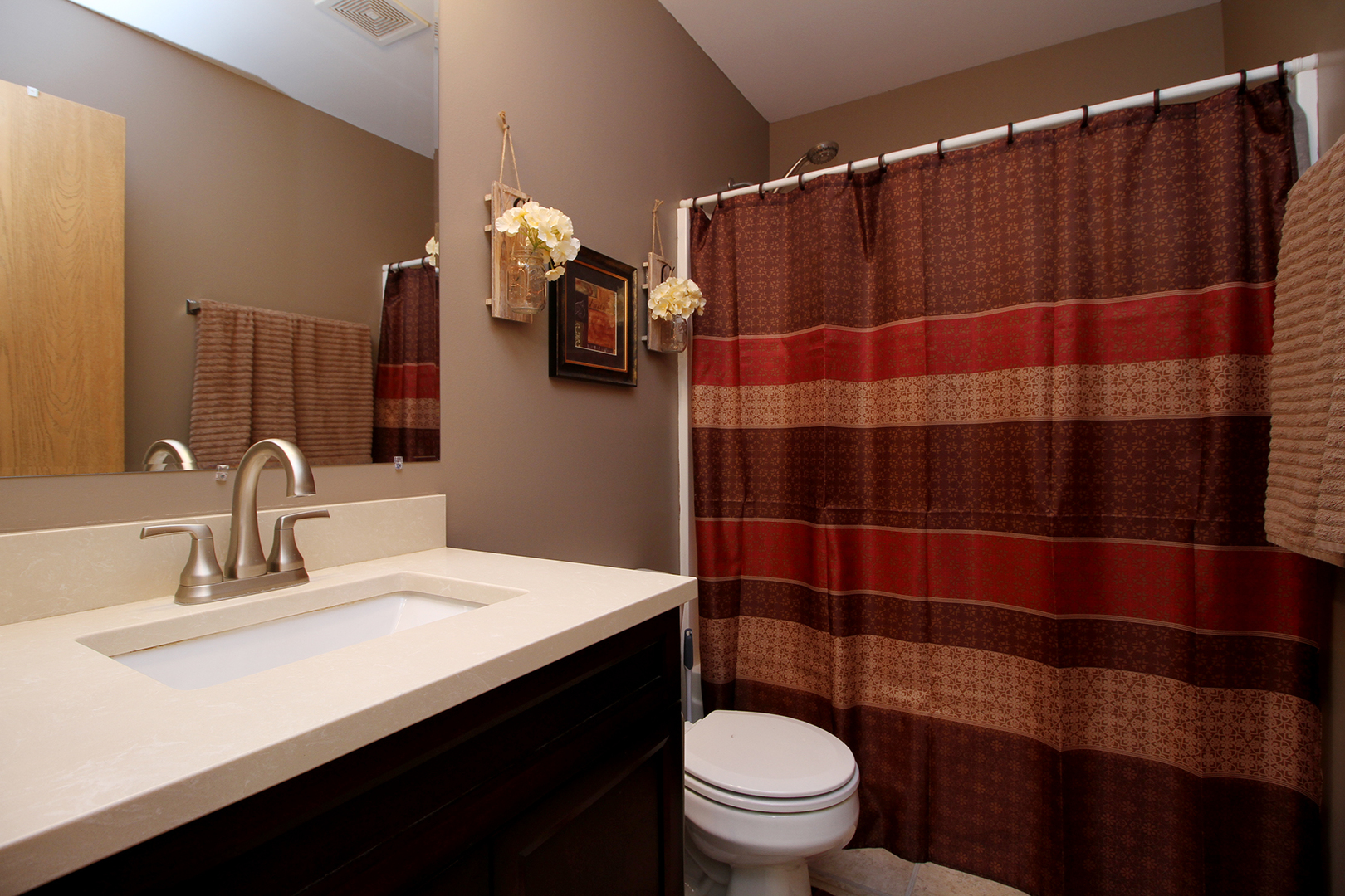 25265 Faraday Road, Unit 25265 Manhattan, IL 60442 - Photo 12 of 15 a bathroom with a sink a toilet and shower