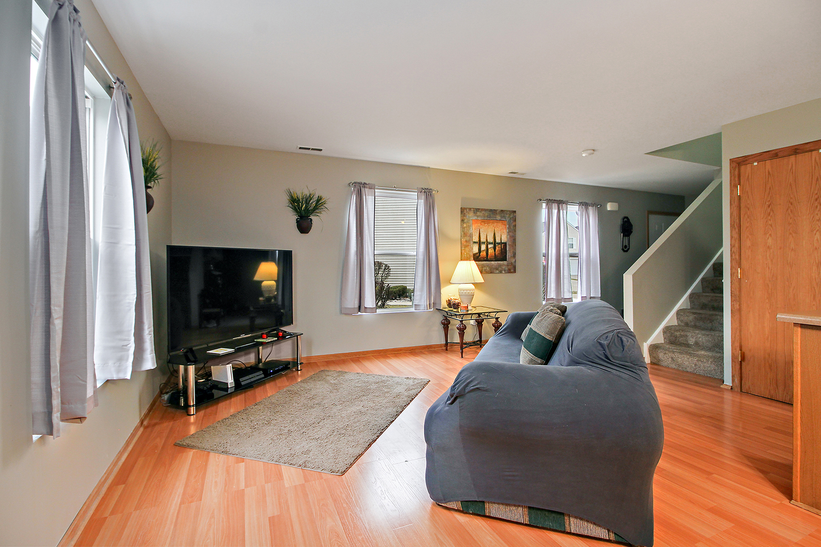25265 Faraday Road, Unit 25265 Manhattan, IL 60442 - Photo 3 of 15 a living room with furniture and a flat screen tv