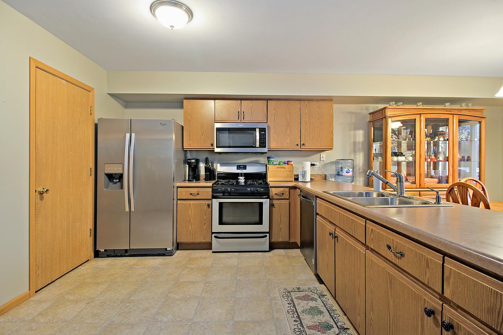 25265 Faraday Road, Unit 25265 Manhattan, IL 60442 - Photo 5 of 15 a kitchen with stainless steel appliances granite countertop a refrigerator stove and sink