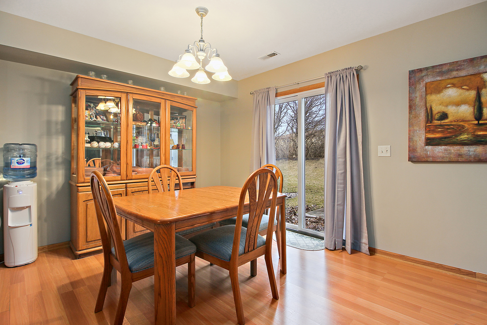 25265 Faraday Road, Unit 25265 Manhattan, IL 60442 - Photo 7 of 15 a view of a dining room with furniture window and wooden floor