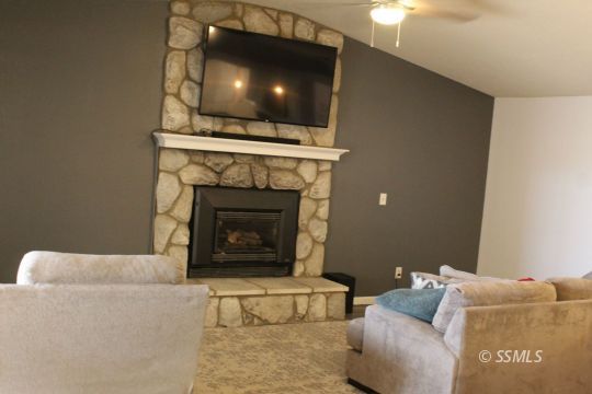 401 Ashton Street Ridgecrest, CA 93555 - Photo 13 of 36 a living room with furniture and a fireplace