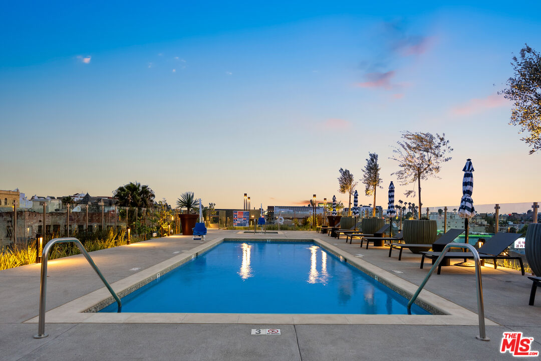 800 Western Avenue, Unit 243 Los Angeles, CA 90005 - Photo 23 of 26 a view of a swimming pool with sitting area