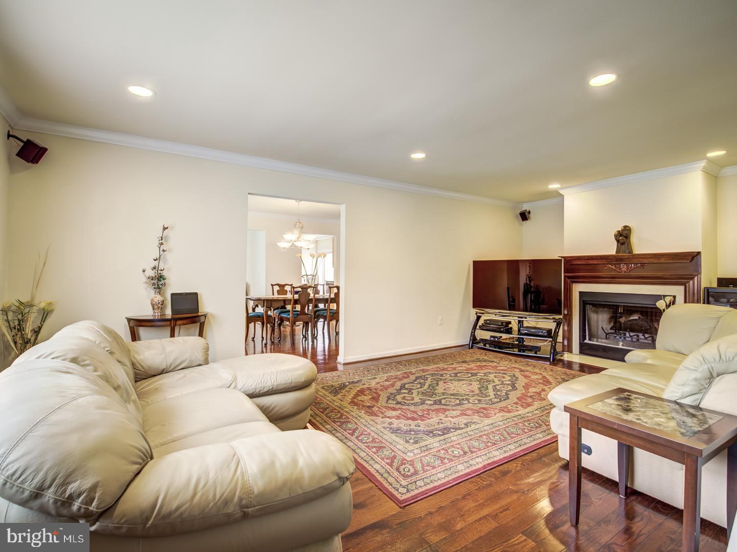 19400 White Ground Road Boyds, MD 20841 - Photo 25 of 59 a living room with furniture and a fireplace