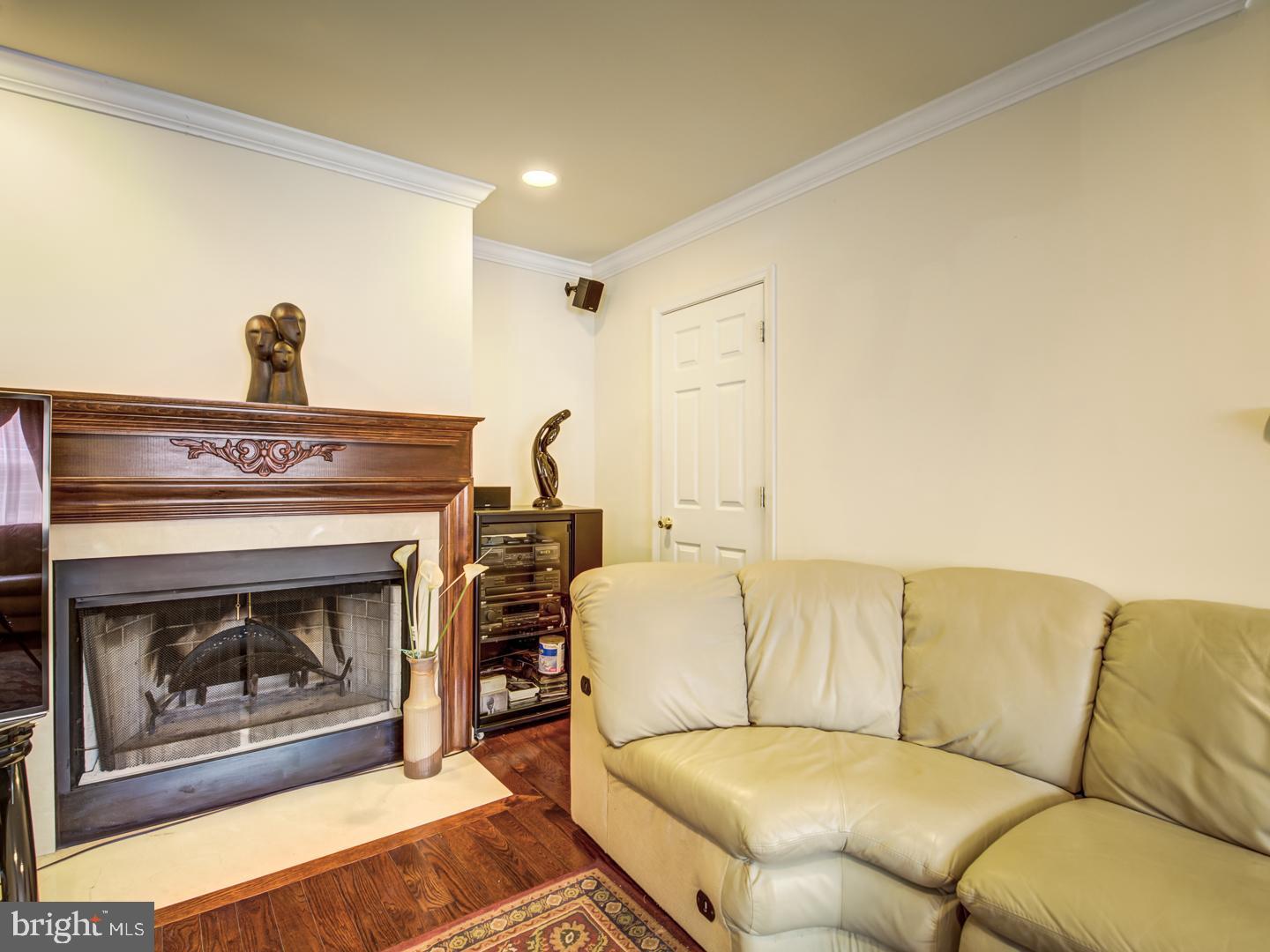 19400 White Ground Road Boyds, MD 20841 - Photo 26 of 59 a living room with furniture and a fireplace