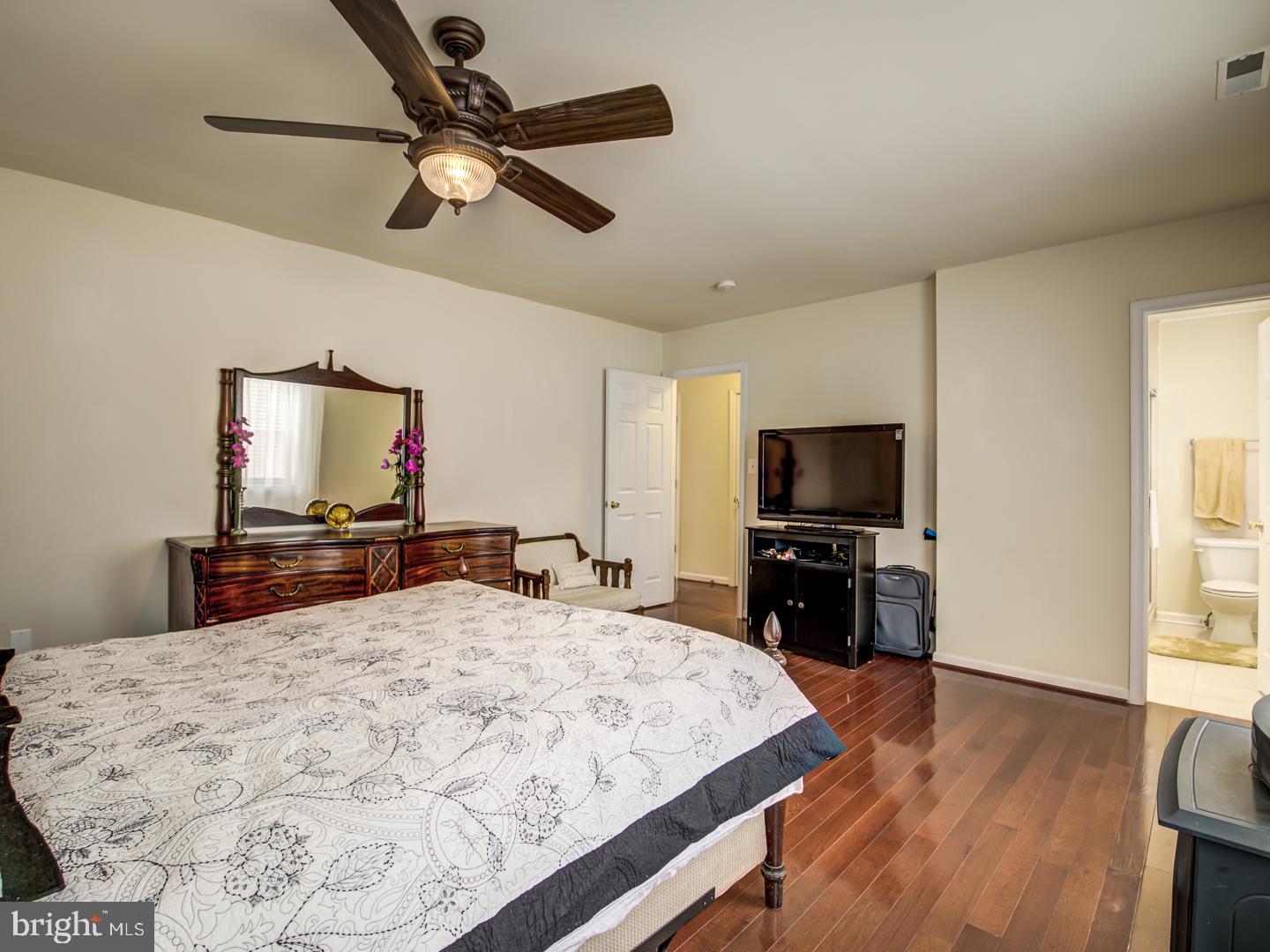 19400 White Ground Road Boyds, MD 20841 - Photo 34 of 59 a bedroom with a bed and a flat screen tv