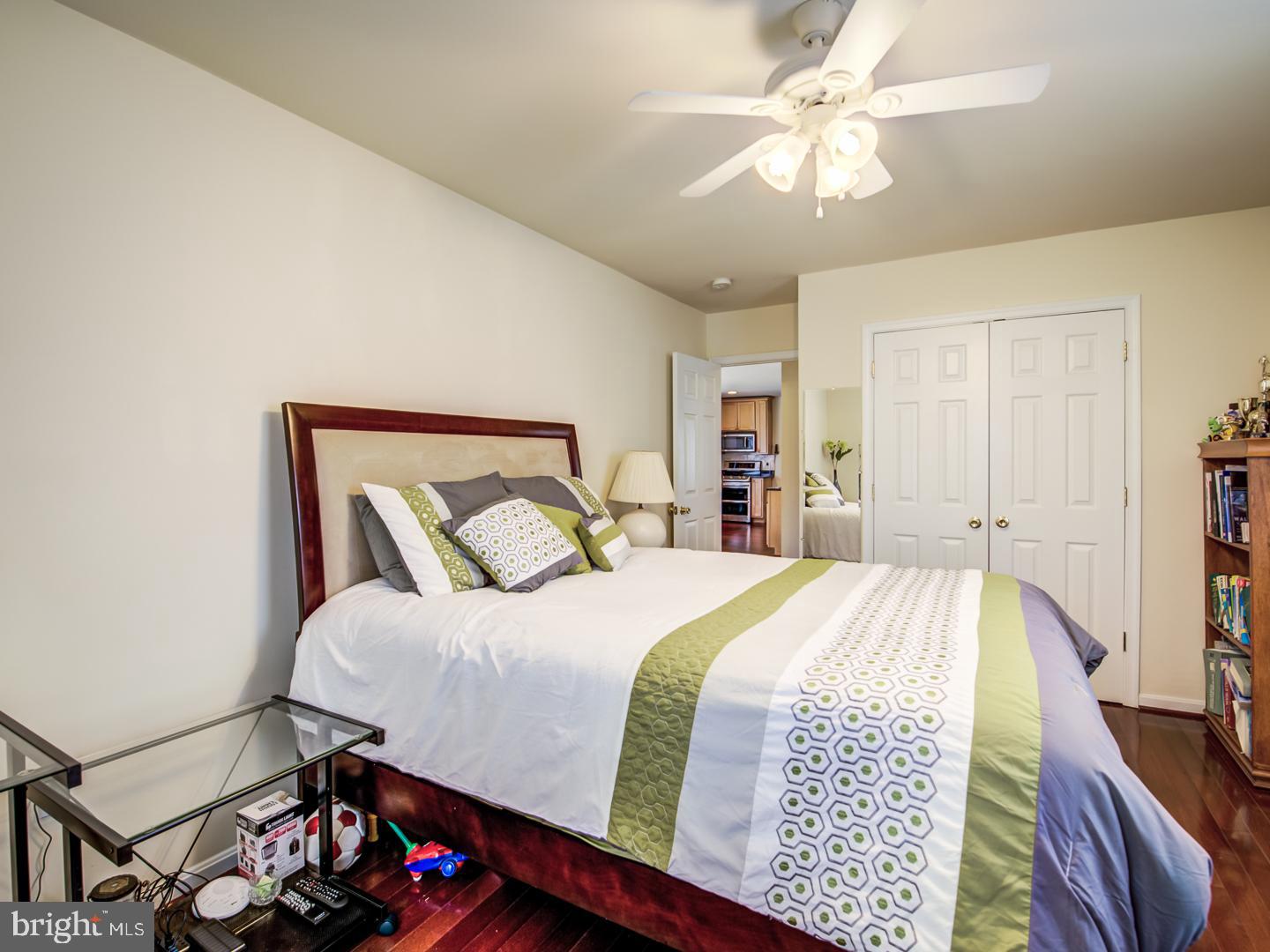 19400 White Ground Road Boyds, MD 20841 - Photo 38 of 59 a bedroom with a bed and a chandelier