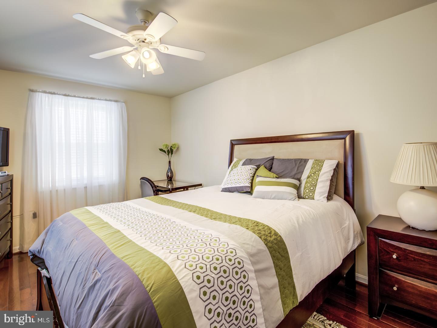 19400 White Ground Road Boyds, MD 20841 - Photo 40 of 59 a bedroom with a bed and a chandelier