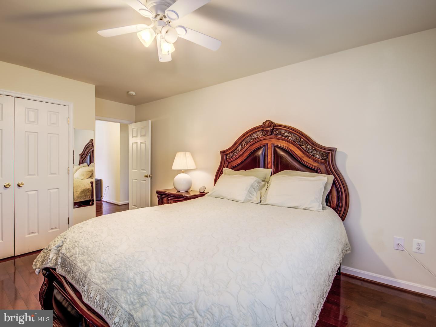 19400 White Ground Road Boyds, MD 20841 - Photo 44 of 59 a bedroom with a bed and a chandelier