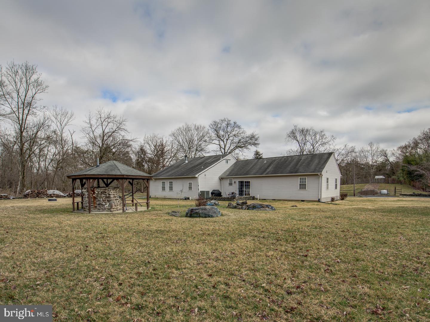 19400 White Ground Road Boyds, MD 20841 - Photo 56 of 59 a view of a large house with a big yard and large tree