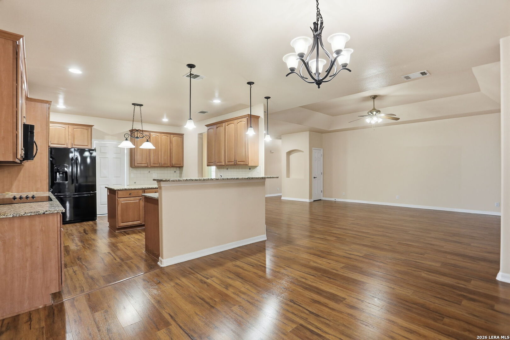 8814 Spanish Moss Windcrest, TX 78239 - Photo 15 of 50 a view of a kitchen and refrigerator