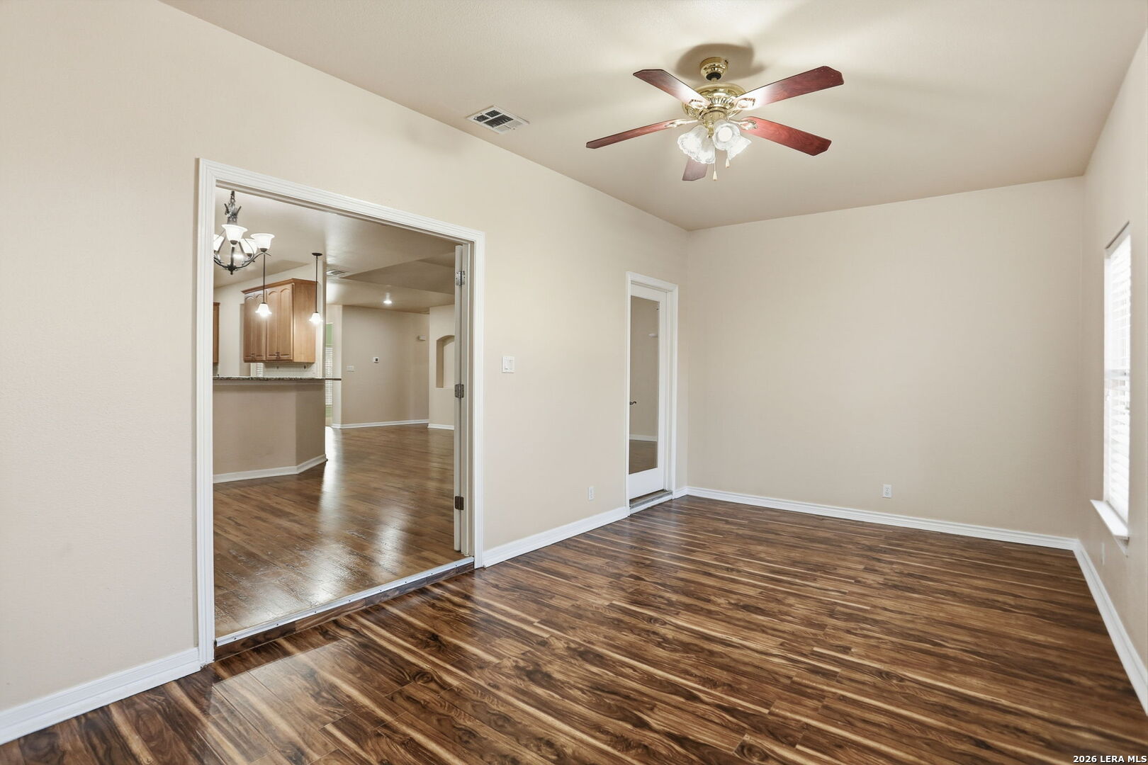 8814 Spanish Moss Windcrest, TX 78239 - Photo 21 of 50 wooden floor in an empty room with a window