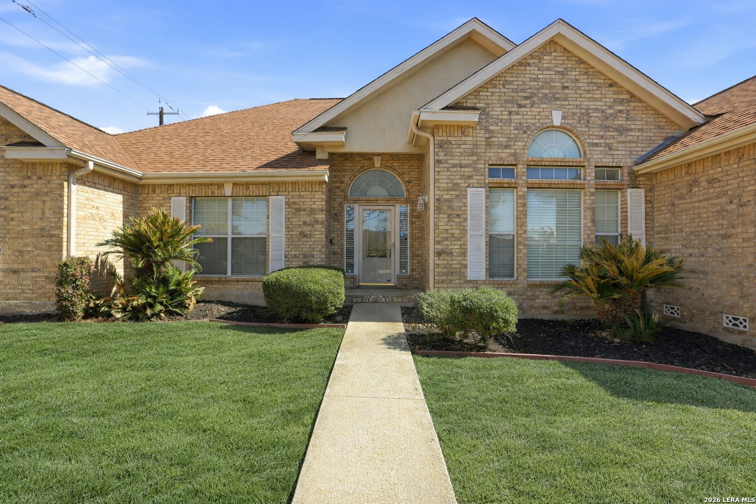 8814 Spanish Moss Windcrest, TX 78239 - Photo 3 of 50 a front view of a house with a yard