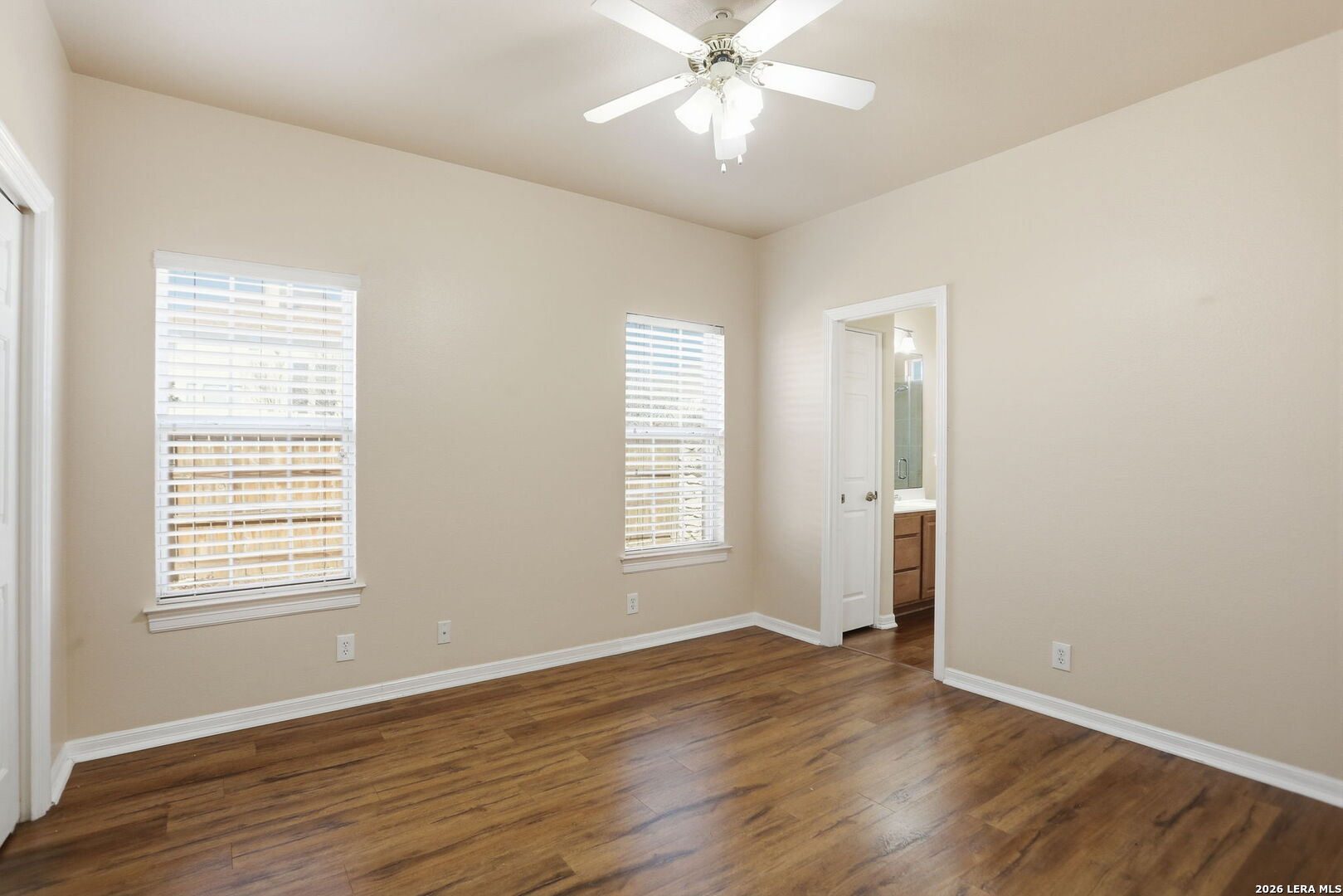 8814 Spanish Moss Windcrest, TX 78239 - Photo 32 of 50 a view of an empty room with wooden floor and a window