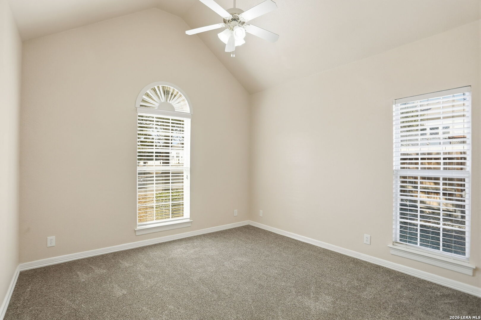 8814 Spanish Moss Windcrest, TX 78239 - Photo 39 of 50 an empty room with windows and fan