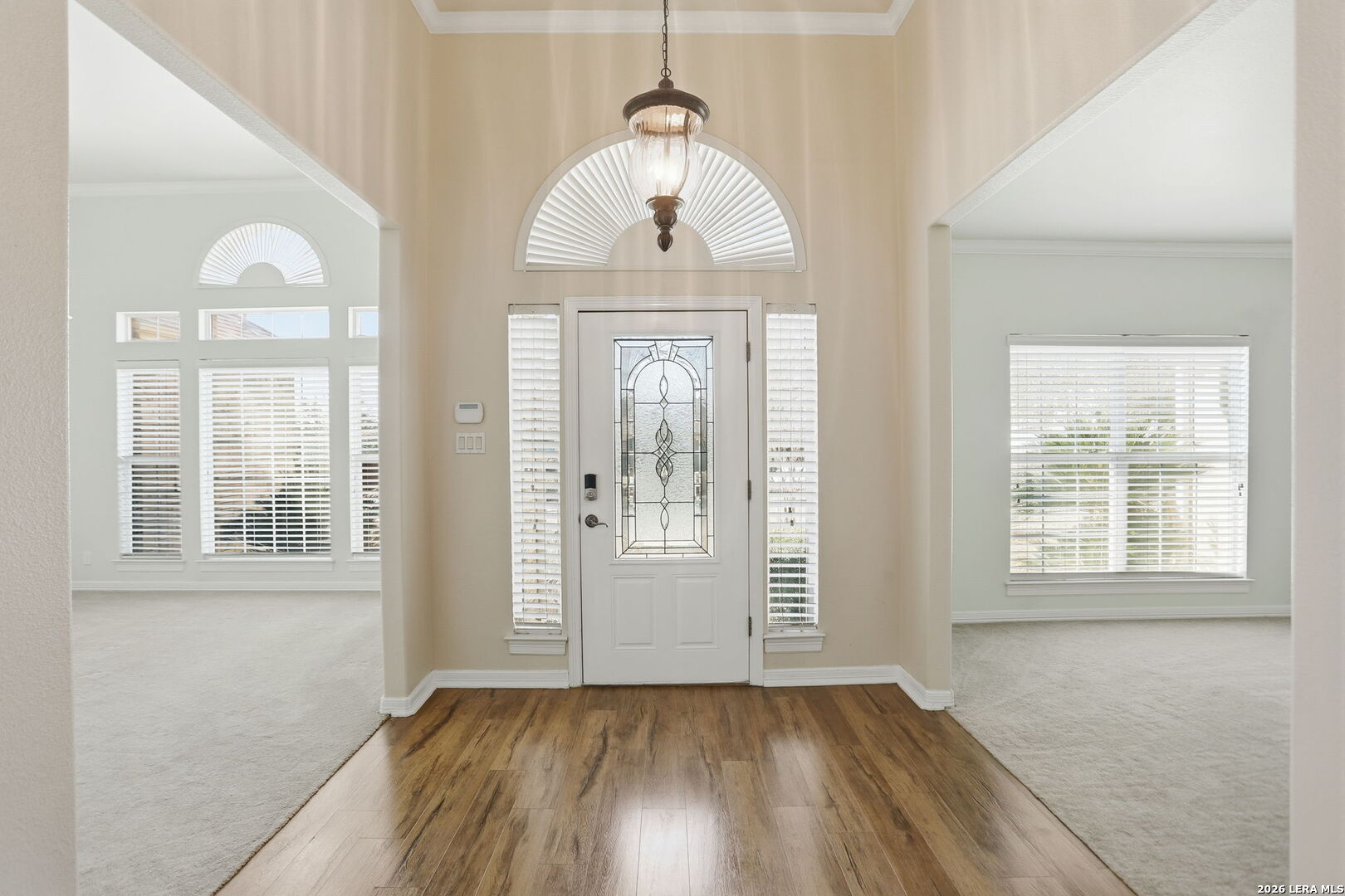 8814 Spanish Moss Windcrest, TX 78239 - Photo 4 of 50 an empty room with wooden floor cabinet and windows