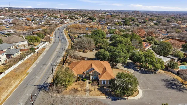 an aerial view of residential houses with outdoor space
