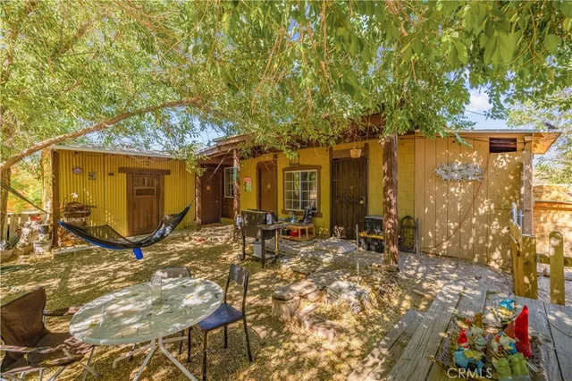 a view of house with yard