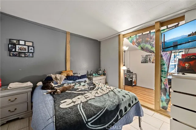 a bedroom with a bed and the view of bedroom