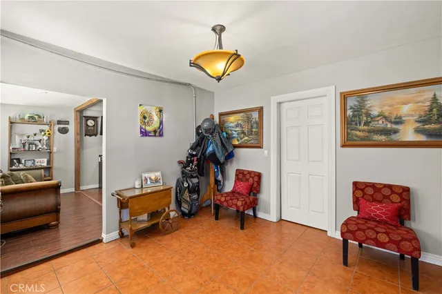 a view of a bedroom with workspace and a window