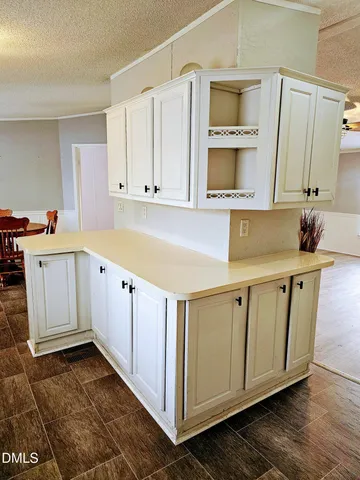 a view of a kitchen with cabinets