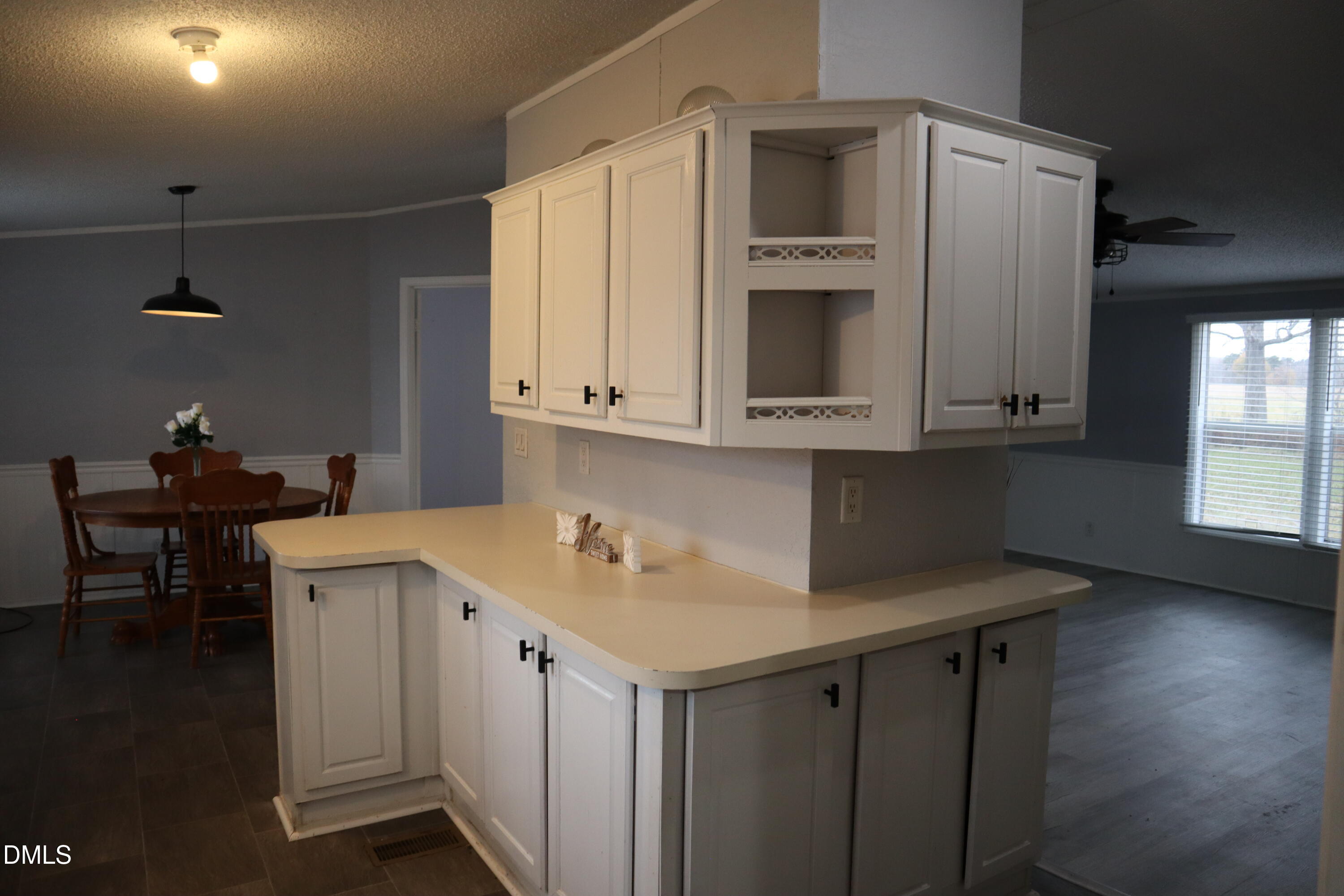 4762 Old Allensville Road Roxboro, NC 27574 - Photo 15 of 33 a kitchen with a sink cabinets and wooden floor
