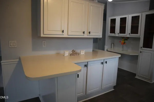 a kitchen with stainless steel appliances a sink stove and microwave