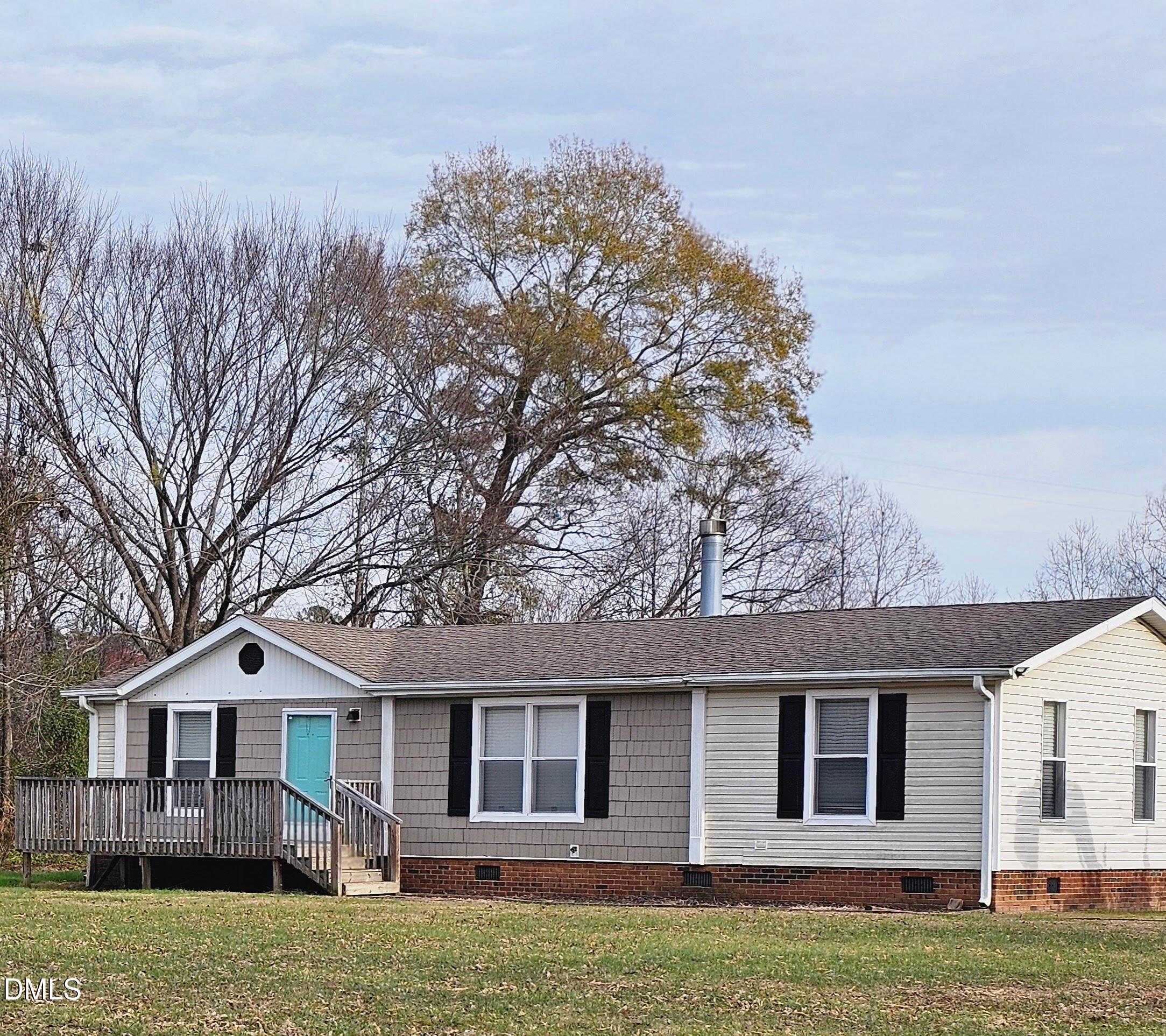 4762 Old Allensville Road Roxboro, NC 27574 - Photo 29 of 33 a front view of a house with a yard