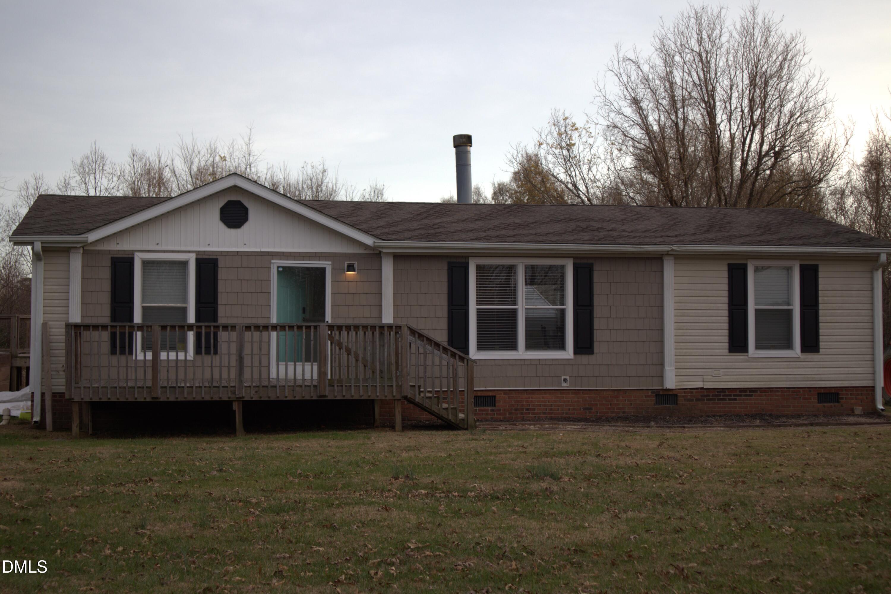 4762 Old Allensville Road Roxboro, NC 27574 - Photo 30 of 33 a front view of a house with a garden