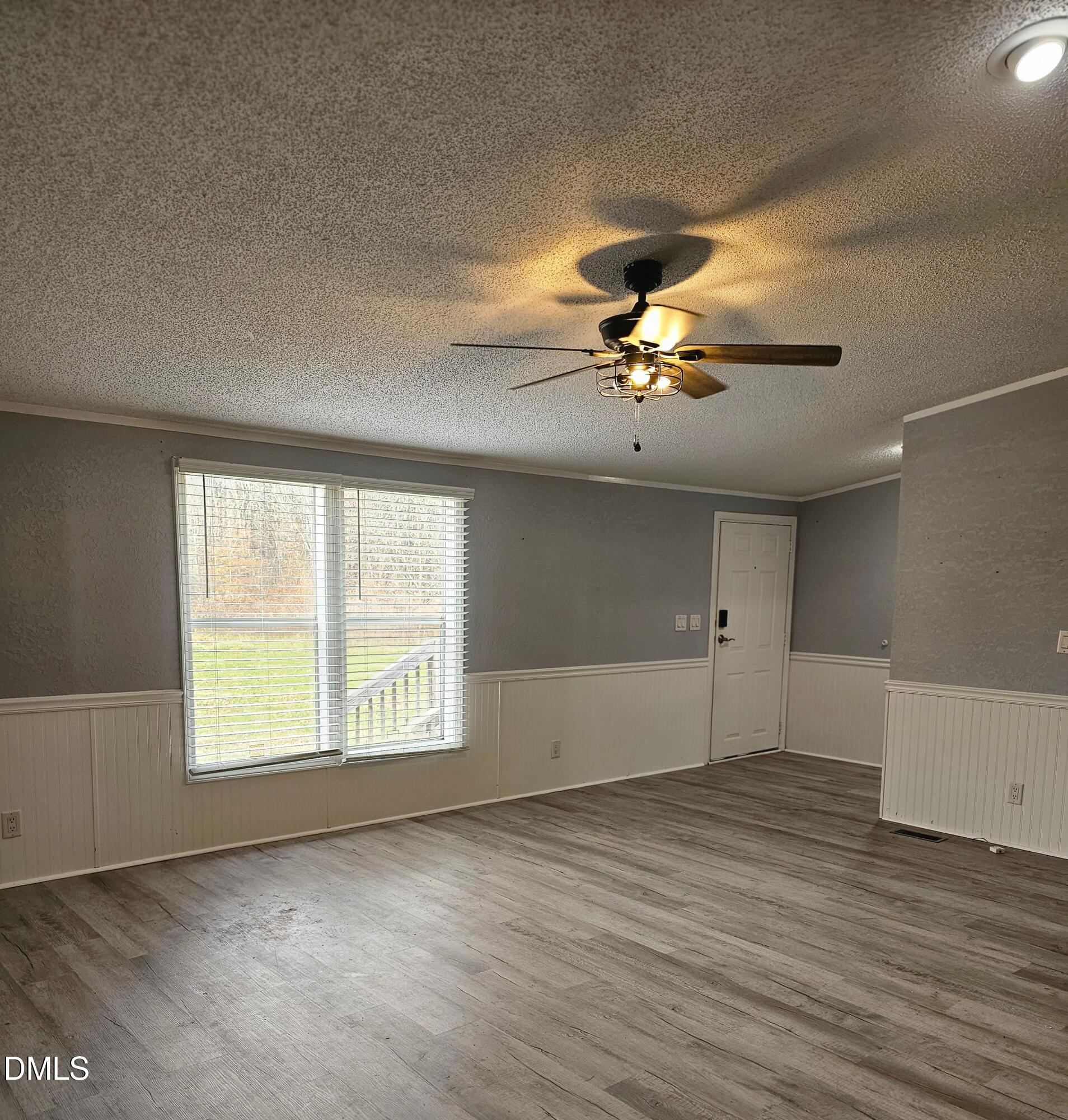 4762 Old Allensville Road Roxboro, NC 27574 - Photo 6 of 33 wooden floor in an empty room with a window