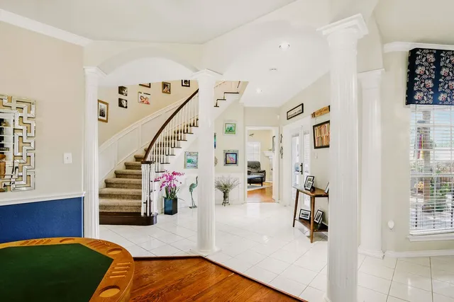a view of a livingroom with furniture and staircase