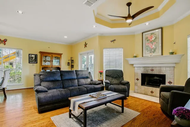a living room with furniture and a fireplace