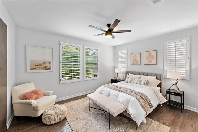 a spacious bedroom with a bed and a window