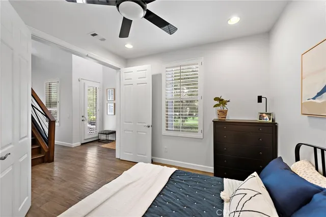 a bedroom with furniture and window