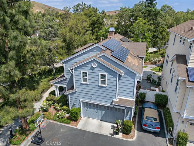 an aerial view of a house with a yard