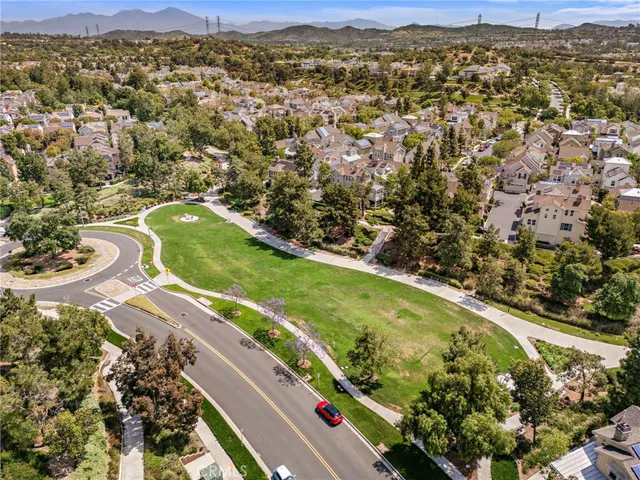 an aerial view of a residential houses with outdoor space